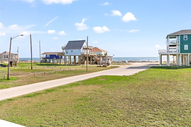 exterior space with a yard and a water view