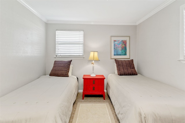 carpeted bedroom featuring crown molding