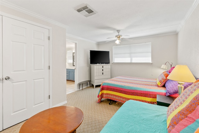 bedroom with light carpet, ornamental molding, ensuite bathroom, and ceiling fan