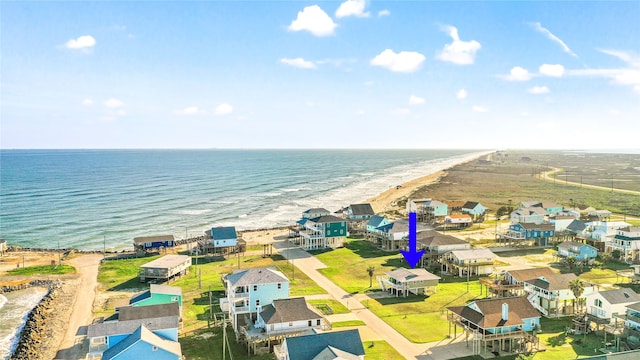 drone / aerial view featuring a view of the beach and a water view