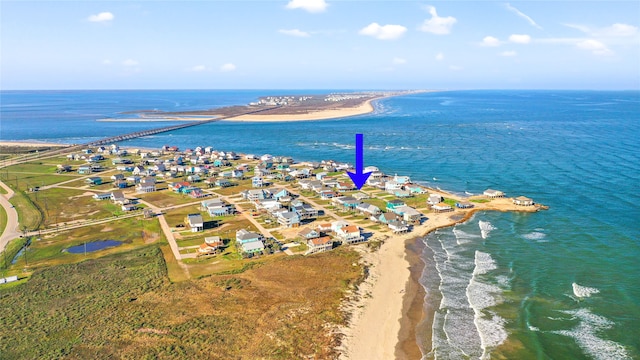 bird's eye view with a view of the beach and a water view