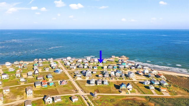 bird's eye view featuring a beach view and a water view