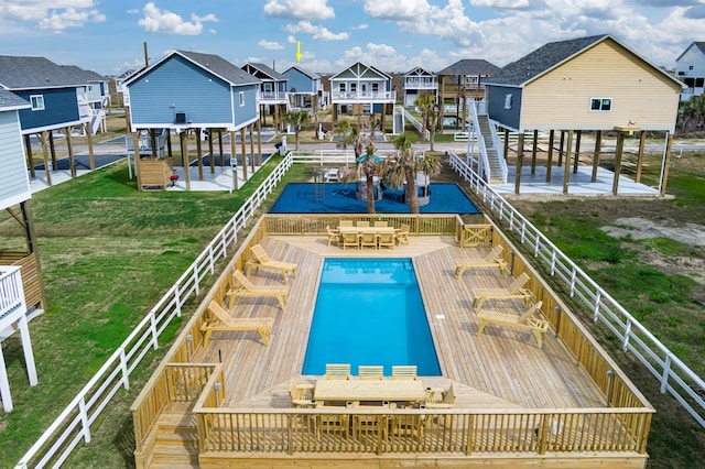 view of pool featuring a patio area and a lawn