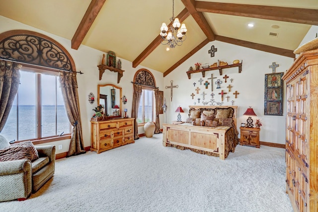 bedroom featuring an inviting chandelier, beam ceiling, light carpet, and a water view