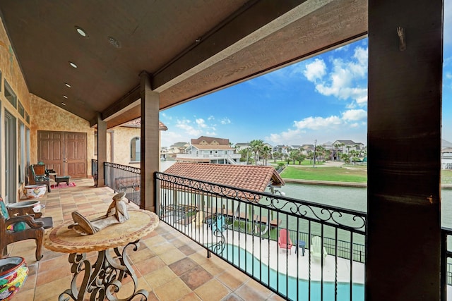 balcony featuring a water view