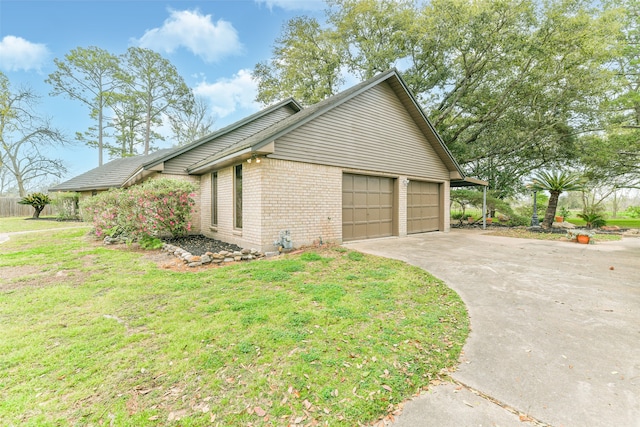 view of home's exterior with a yard and a garage