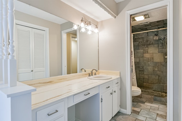 bathroom with toilet, walk in shower, and vanity