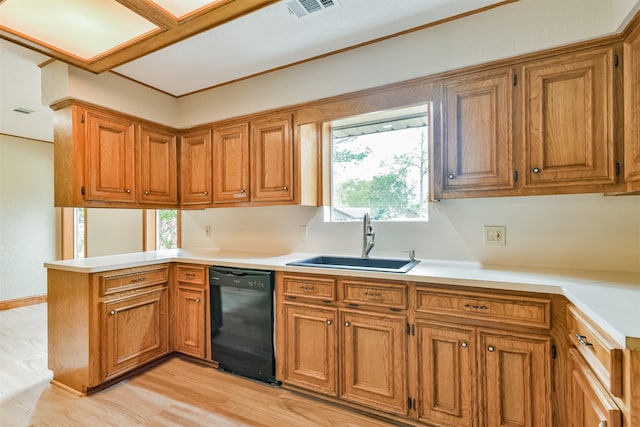 kitchen featuring light hardwood / wood-style flooring, dishwasher, sink, and kitchen peninsula