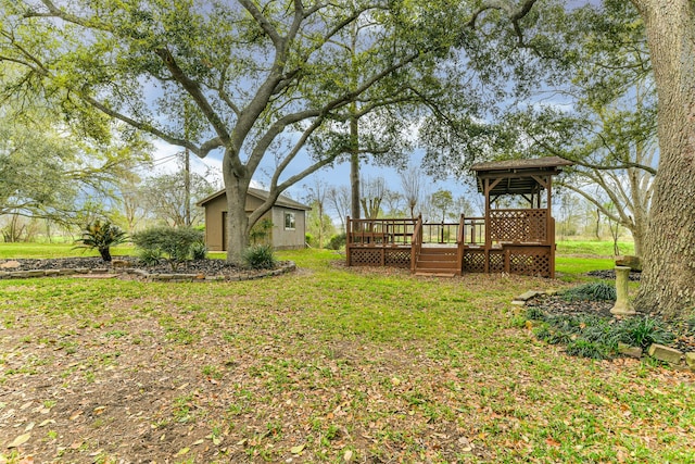 view of yard with a wooden deck