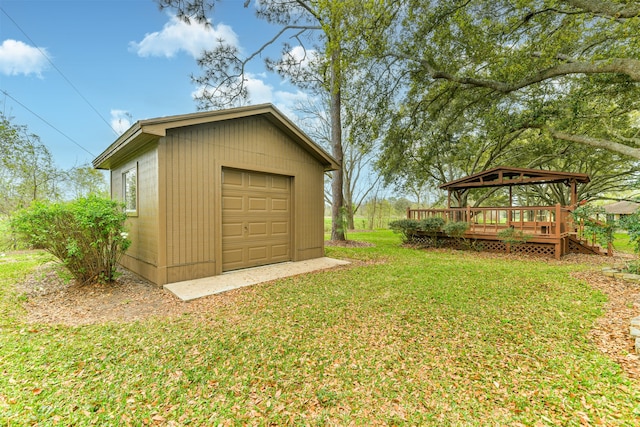 garage featuring a lawn