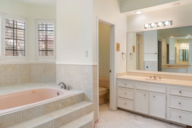 bathroom featuring tiled bath, toilet, tile flooring, and vanity