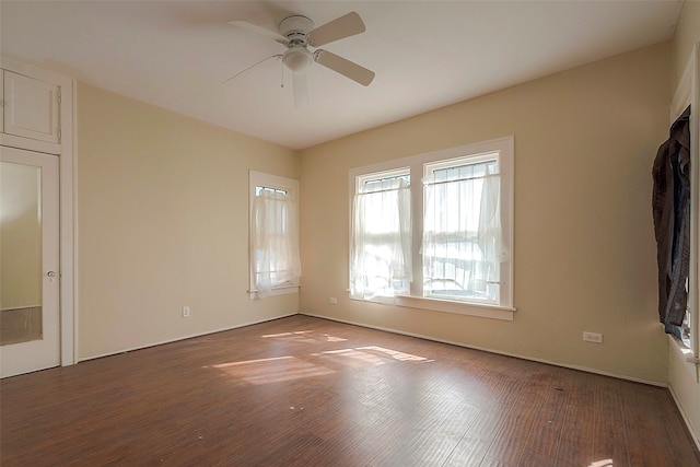 spare room with wood-type flooring and ceiling fan