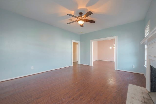 unfurnished living room featuring ceiling fan and dark hardwood / wood-style floors