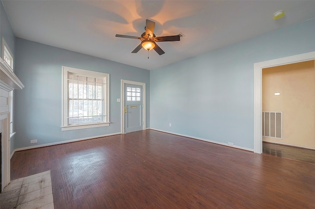 unfurnished room with dark hardwood / wood-style flooring and ceiling fan