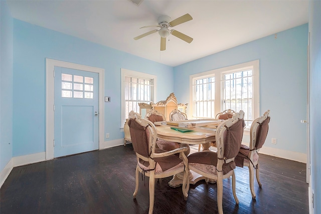 dining space with dark hardwood / wood-style flooring and ceiling fan