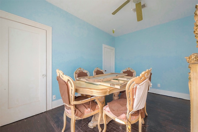 dining room with dark hardwood / wood-style floors and ceiling fan