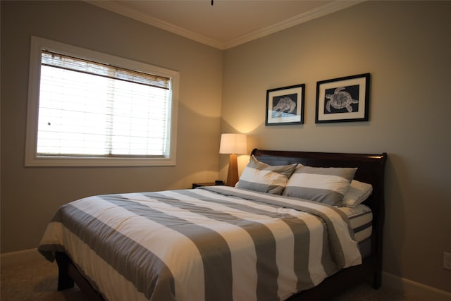 carpeted bedroom with ornamental molding