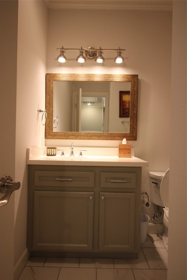 bathroom featuring tile flooring, ornamental molding, toilet, and large vanity