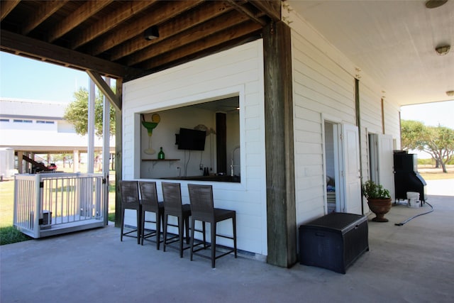 view of patio featuring exterior bar