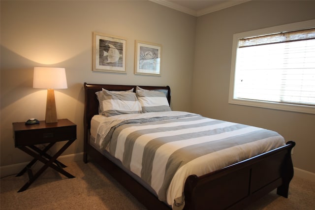 carpeted bedroom with crown molding