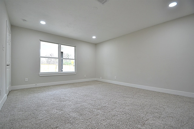 unfurnished room featuring carpet flooring