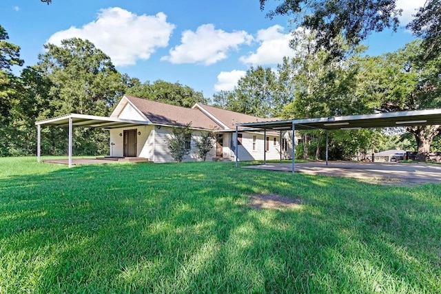 ranch-style house featuring a front lawn and a carport