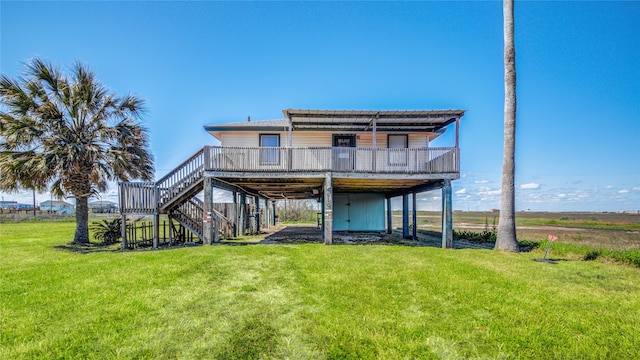 rear view of house featuring a deck and a lawn