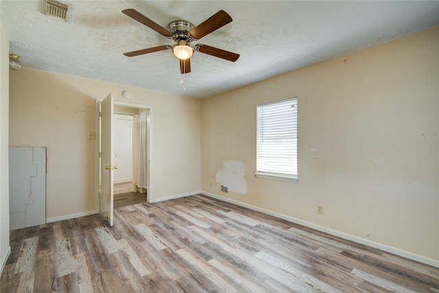 unfurnished bedroom featuring ceiling fan and light hardwood / wood-style flooring