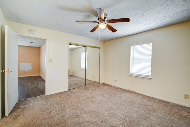 unfurnished bedroom with ceiling fan, a textured ceiling, and light hardwood / wood-style floors