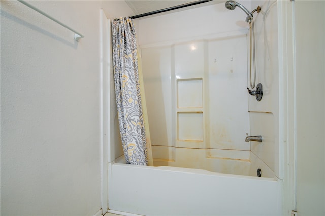 bathroom featuring shower / bath combo with shower curtain