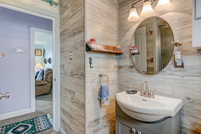 bathroom with tile walls and vanity with extensive cabinet space