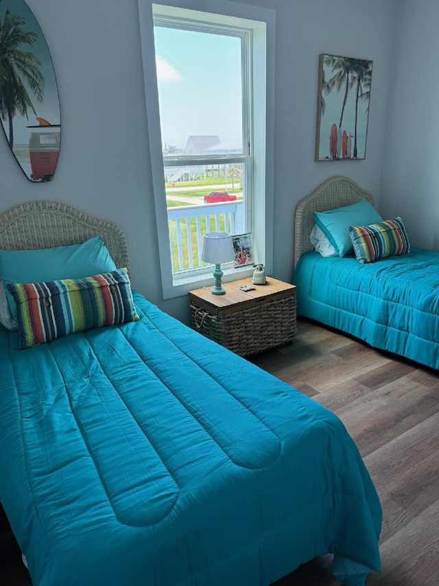 bedroom with hardwood / wood-style flooring