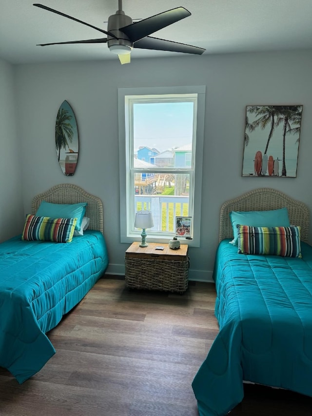 bedroom featuring hardwood / wood-style flooring and ceiling fan