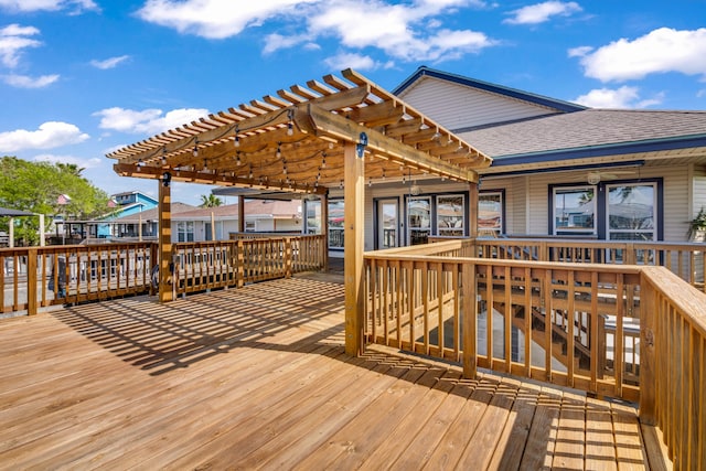 wooden deck featuring a pergola