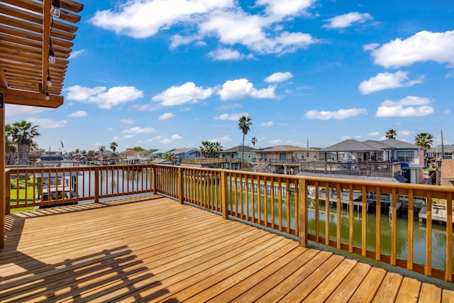 wooden deck with a water view