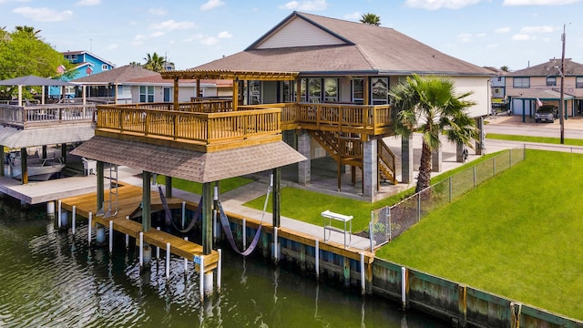 dock area featuring a water view and a yard