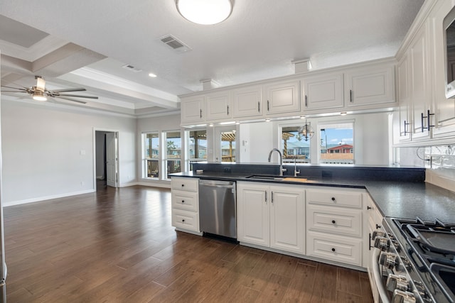 kitchen with sink, white cabinetry, dark wood-type flooring, beam ceiling, and stainless steel appliances