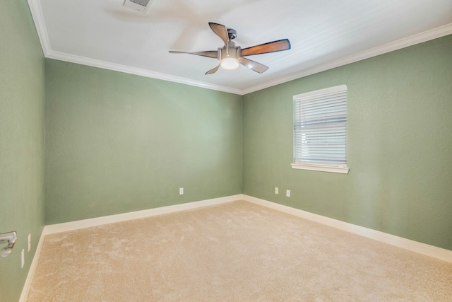 unfurnished room featuring ceiling fan, carpet, and crown molding