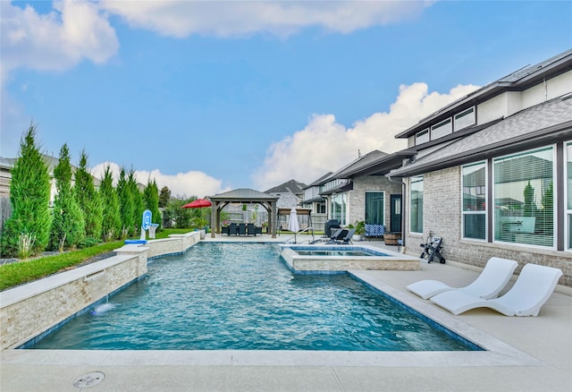 view of pool with pool water feature, a gazebo, a patio area, and an in ground hot tub