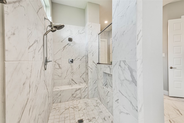 bathroom featuring a tile shower