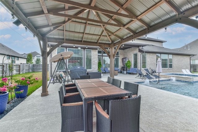 view of patio featuring central AC unit, a fenced in pool, a gazebo, and a grill