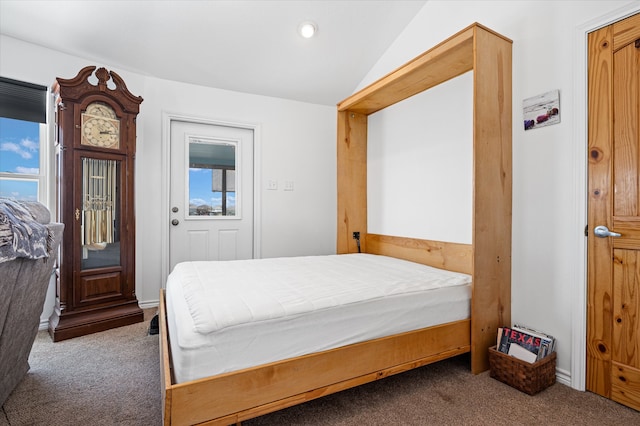 carpeted bedroom featuring vaulted ceiling