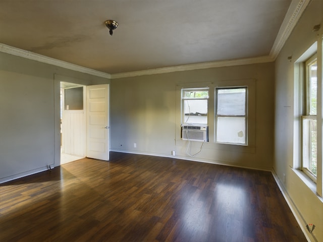 empty room with ornamental molding and dark hardwood / wood-style floors