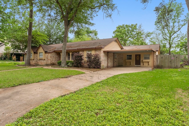 single story home featuring a front yard and a carport