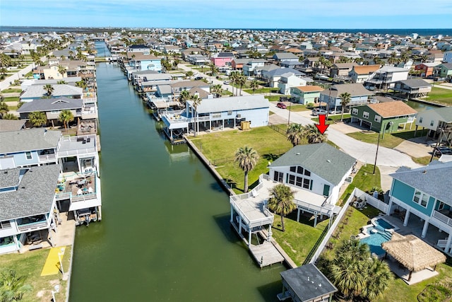 aerial view featuring a residential view and a water view