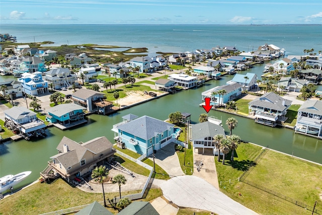 aerial view with a water view and a residential view