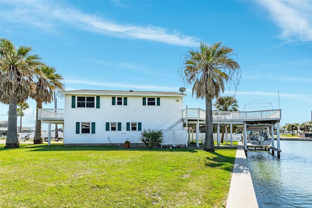 exterior space with a water view and a yard