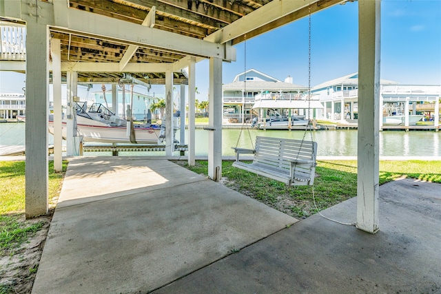 view of patio / terrace with a boat dock and a water view