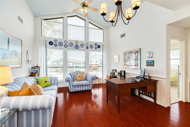 office area with ceiling fan with notable chandelier, high vaulted ceiling, and dark wood-type flooring