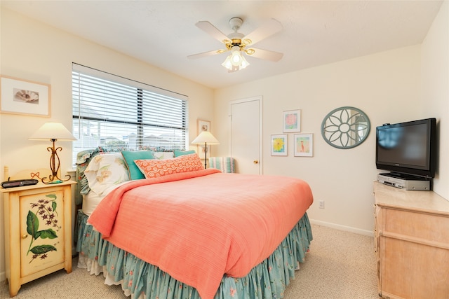 bedroom featuring ceiling fan and light colored carpet